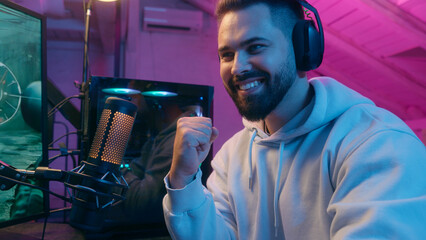 Excited winner champion Caucasian guy male gamer streamer man winning luck achievement victory...