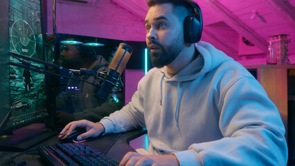 Caucasian man guy male gamer streamer playing online game shocked worried anxiety astonish shock at...