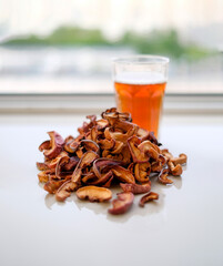 Compote dried fruits. Refreshing drink made from dried fruits. A pile of dried fruit. Lots of pieces of dry fruit. Glass of compote