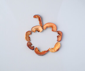 Several pieces of dry fruits on a white background. Healthy preserves dried fruits. A pile of dried fruit. Top view. Composition of pieces