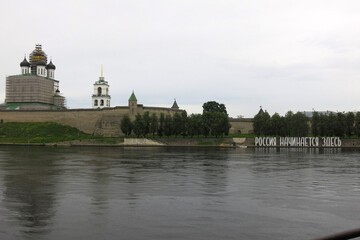 Trinity Cathedral of the Pskov Kremlin under restoration Has an inscription on the shore: Russia...