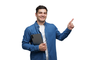 Smiling young man in casual denim shirt holds tablet while pointing with excitement transparent background