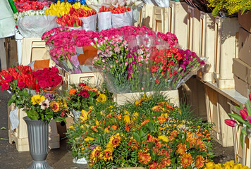 Flower shop outside of market selling floral arrangements