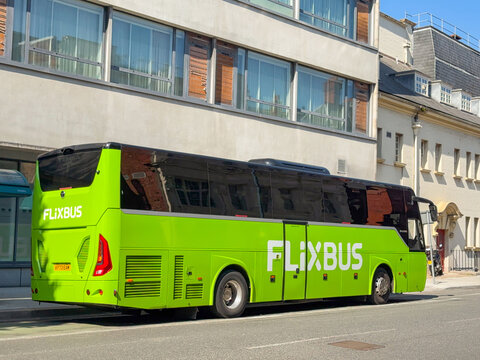 Cardiff, Wales, UK - 18 June 2025: Side view of an express bus operated by budget coach company Flixbus stopped in Cardiff city cnetre