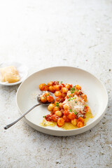 Potato gnocchi with tomato and cheese
