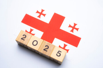 2025, Georgia flag with date block, Concept, Important events for Georgia the new year, election,...