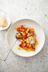 Potato gnocchi with tomato and cheese
