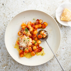 Potato gnocchi with tomato and cheese