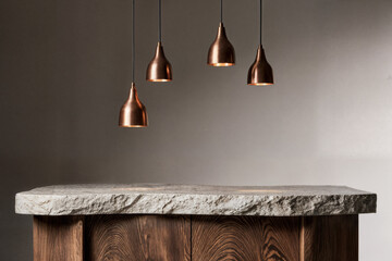 Warm wood cabinets and copper pendant lights on an organically shaped stone island