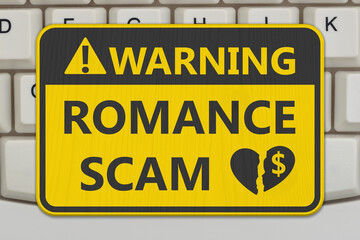 Fototapeta premium Romance Scam yellow warning sign on a computer keyboard