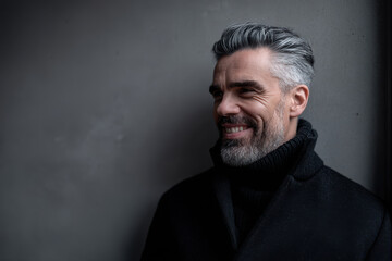 portrait of showrunner with inspired smile positioned on left side of frame