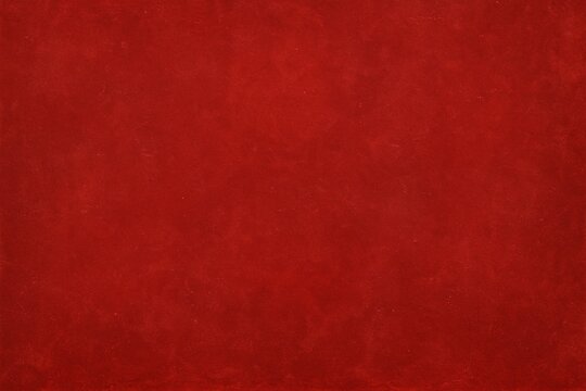 A high-resolution image featuring a rich, deep red textured background with subtle tonal variations. The surface has a soft, velvety appearance, making it ideal for use in elegant design projects