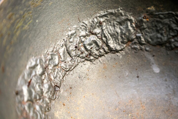 Damaged Interior of a Pot: Peeling, Cracking, and Bubbling of Non-Stick Coating Revealed.
