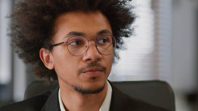 Portrait pensive thoughtful African American man male business dreaming face in glasses looking away contemplate businessman think ideas thoughts search difficult solve doubt thinking office hesitate