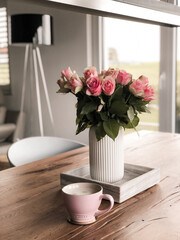 Soft Elegance — Pink Roses in a Vase with Hot Drink in a Stylish Home