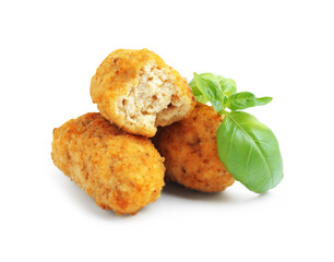 Tasty fried croquettes and basil isolated on white