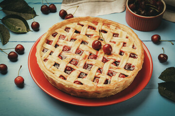 Tasty cherry pie on light blue wooden table, closeup