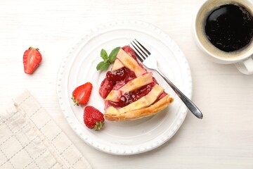 Piece of tasty strawberry pie and berries on white wooden table, top view
