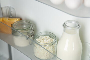 Different dairy products in fridge, closeup view