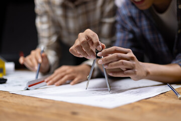 Collaboration female architects brainstorming discuss construction project design blueprints on...