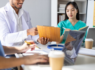 Doctors are meeting at the hospital to discuss treatment options and share experiences with...