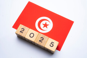 2025, Tunisia flag with date block, Concept, Important events for Tunisia the new year, election, economy, social activities, central bank, Tunisia foreign policy
