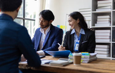Business people having meeting in office. Team of business professionals are discussing work, collaborate on a project.