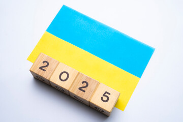 2025, Ukraine flag with date block, Concept, Important events for Ukraine the new year, election, economy, social activities, central bank, Ukraine foreign policy