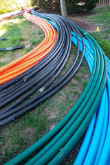 Cables are ready to be laid underground on a city street