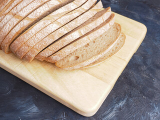 Tasty organic rye bread on a wooden cutting board