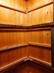 Storage room with wooden shelves and freshly polished interior, ideal for organizing household...