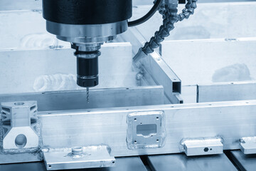 The CNC milling machine hole drilling at the aluminum battery frame parts by drilling tool in the...