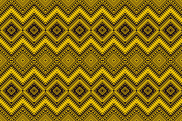 Traditional seamless geometric pattern in yellow and black with tribal diamond motifs.