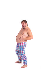 Funny fat man in pajamas early in the morning. White background.