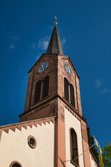 The pointed tower of the Catholic church of St. Arbogast in Sasbachwalden, Germany. Black Forest.