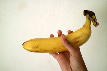 Hand Holding a Ripe Banana