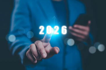 Businessman holds the growth and development of the company in 2026. Business, Marketing, Happy New Year 2026.	
