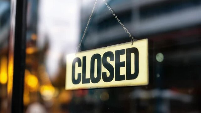 Shop displays closed sign during unexpected hours in bustling urban area