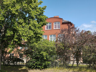 A building behind trees in Katrineholm