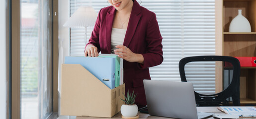 Organized Professional at Work: A focused professional, meticulously organizing files in a well-lit...
