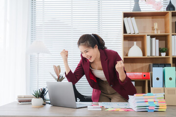Empowered Office Triumph: A dynamic young professional, brimming with elation, celebrates a...