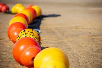 close up of the buoy line on sand beach