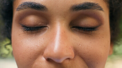 Cropped view close up female dark close eyes closed vision eyesight laser correction African...