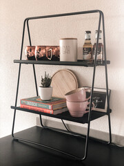 Warm Kitchen Nook — Shelf with Mugs, Coffee Syrup, and Cookbooks