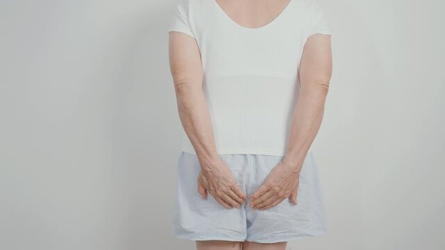 elderly Woman having Anal symptoms pain for Hemorrhoids disease, Constipation, Anal cancer awareness month, diarrhea, Irritable Bowel Syndrome, IBS, Inflammation, Colorectal cancer and Anal Procttis