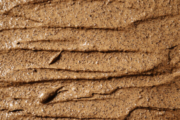 Background of sugar coffee scrub. Cosmetic exfoliation scrub texture. Handmade coffee scrub for body care.