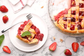 Tasty strawberry pie and berries on white marble table, flat lay