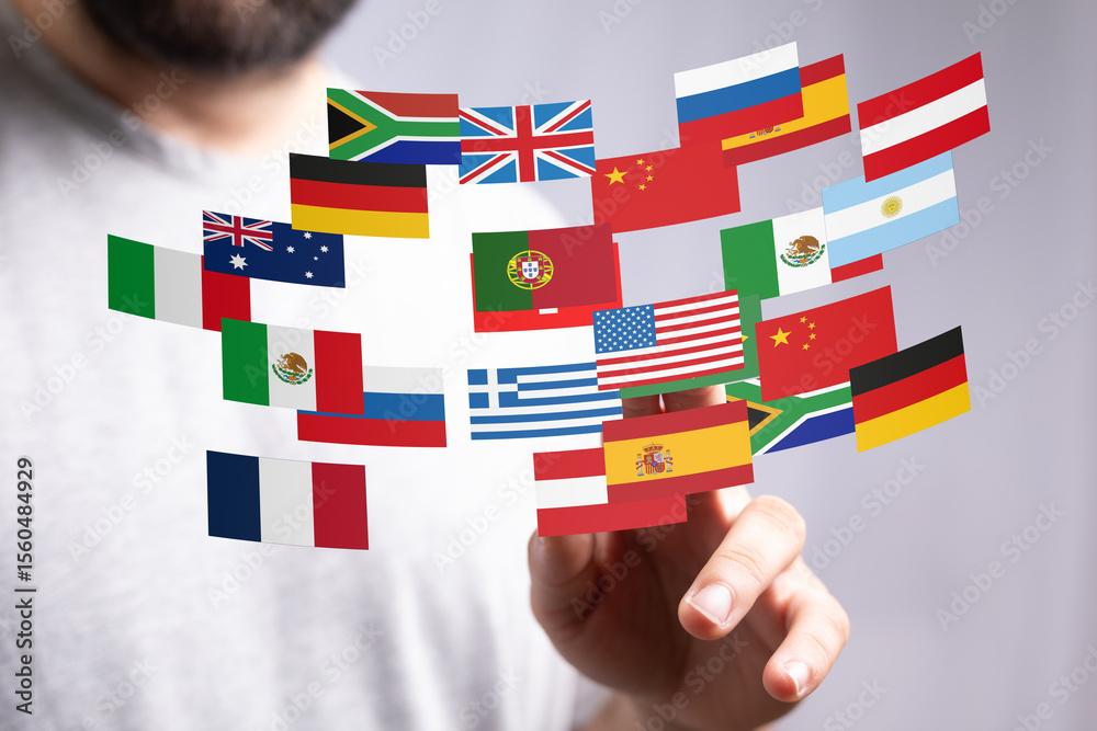 Poster image of a person interacting with a digital display of various national flags, representing global 