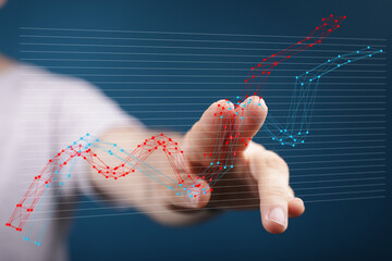 Stock photo of a hand interacting with a graph showing business growth. Perfect for presentations...