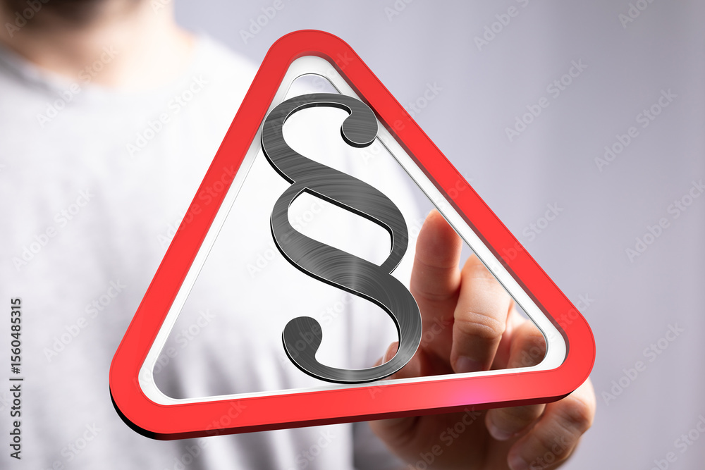 Poster hand points to a digital warning sign with a paragraph symbol, emphasizing legal matters.